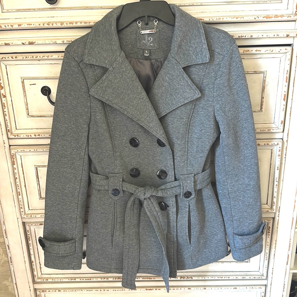 Gray, lightweight women’s pea coat with belt and black double-breasted buttons